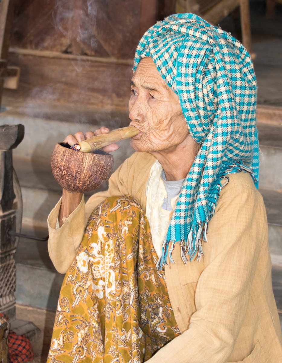 A Lady enjoys her cheroot A Lady enjoys her cheroot