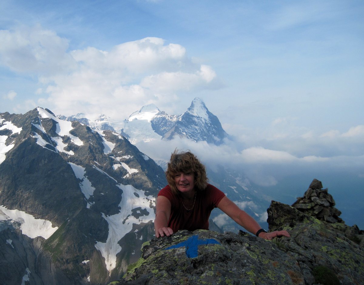 Glenys tops-out on the Chrinnenhorn with the Monch and Eiger in the background Glenys tops-out on the Chrinnenhorn with the Monch and Eiger in the background